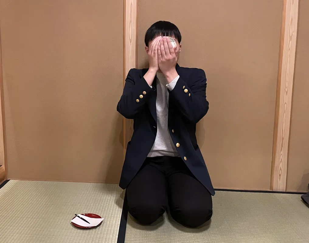 Mihiro Ono kneeling in a tatami room before a tea ceremony